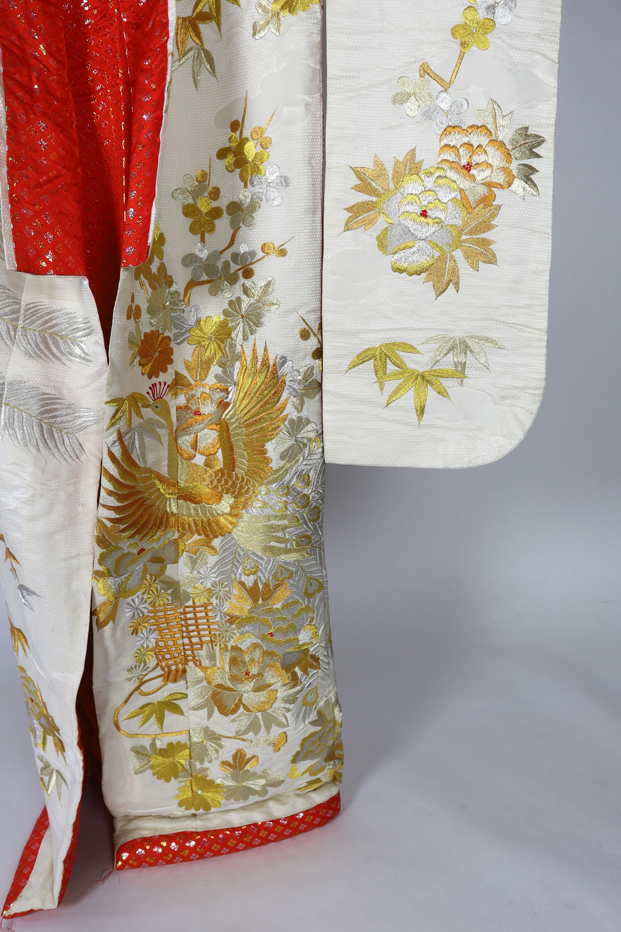 A 1960s-70s vintage Japanese embroidered wedding kimono, embroidered with pewter, bronze, silver and gold coloured metallic threads, into a large decorative design of peacocks with fanned tail feathers and trailing flowe